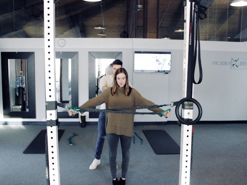 woman receiving functional rehabilitation