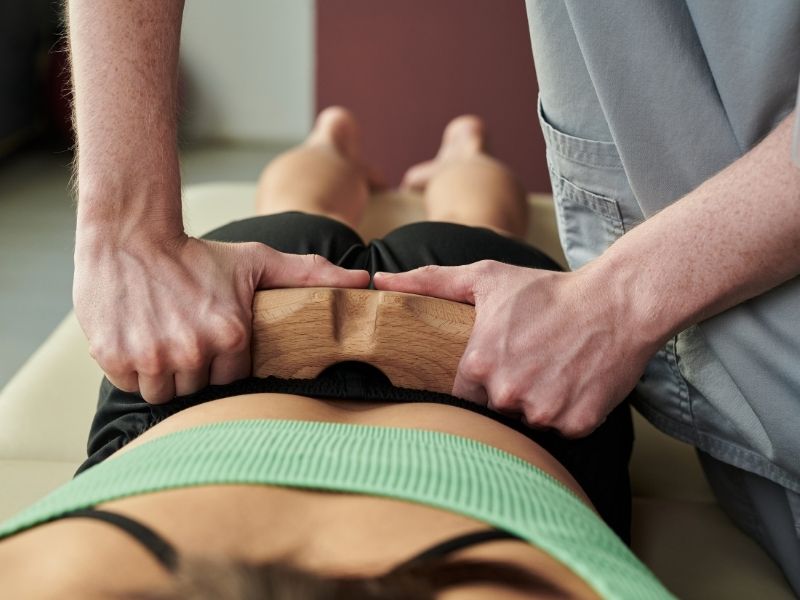 soft tissue treatment on woman's lower back