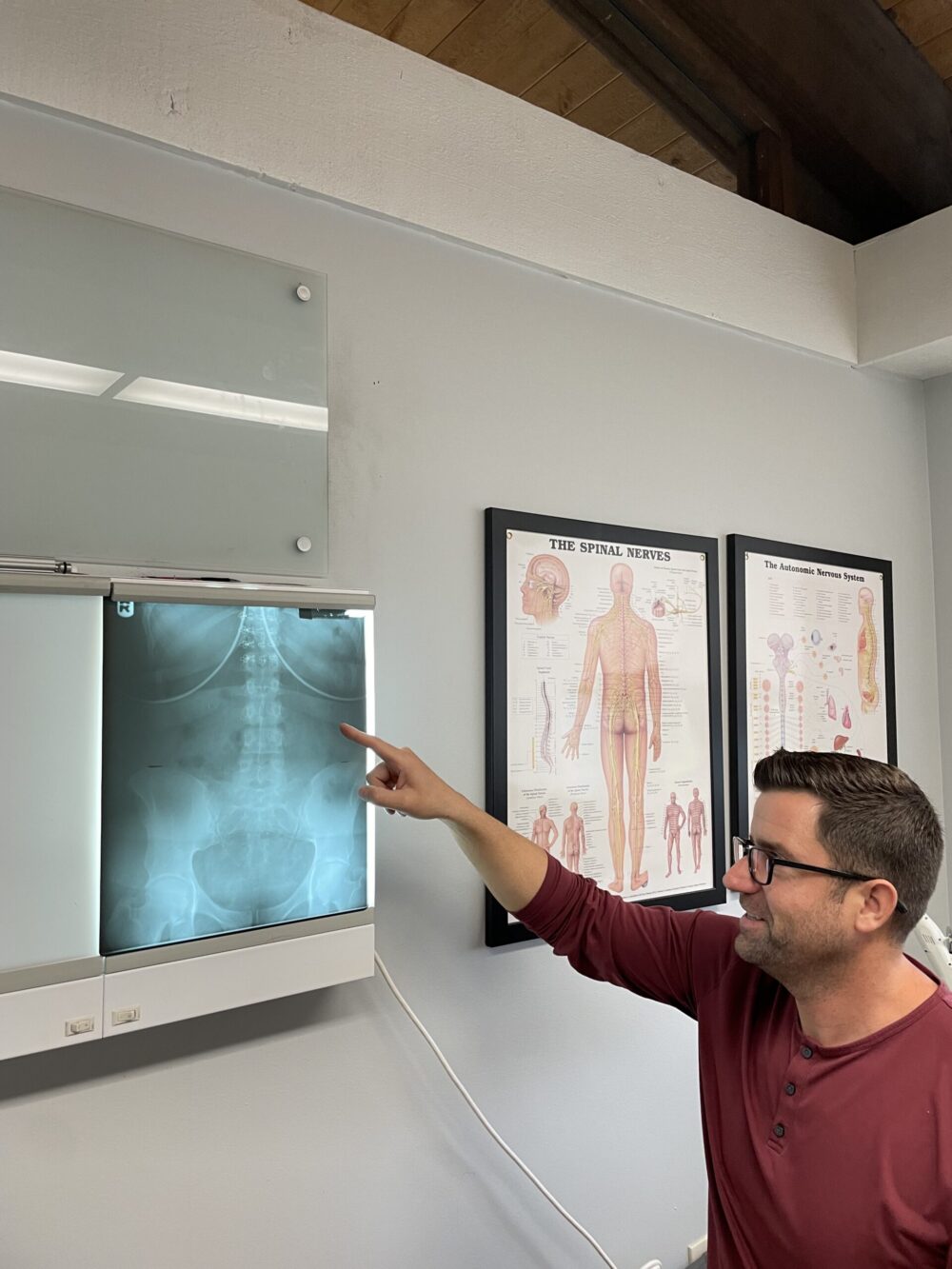 Dr. Chris pointing to x-ray image
